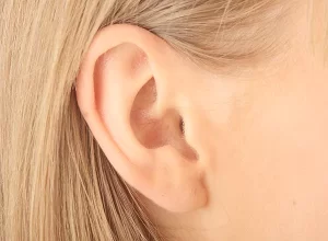 close up shot of woman's right ear otoplasty, pinnaplasty, ear correction 