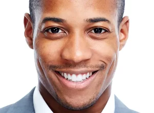 man smiling and showing off white sparkling teeth