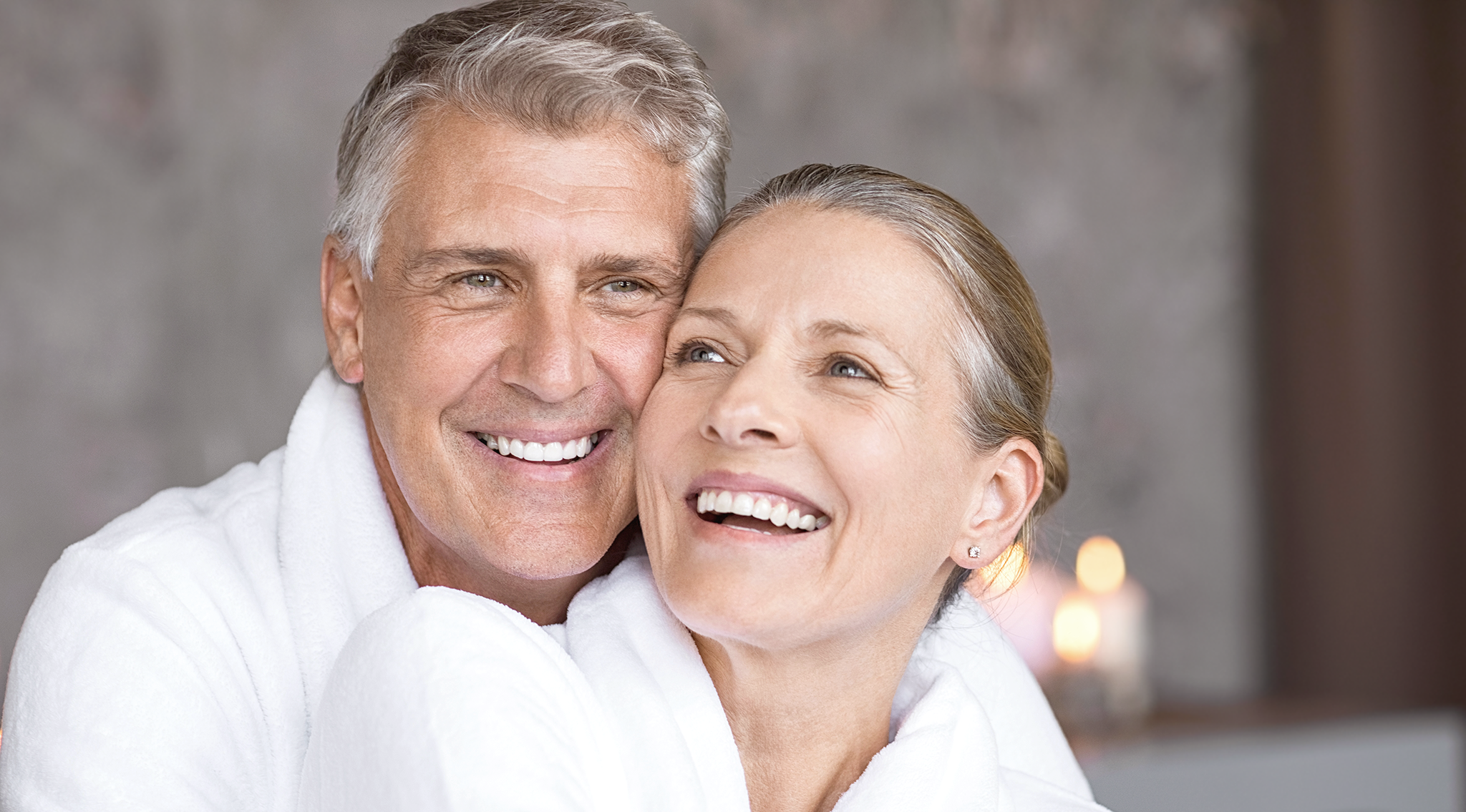 natural portrait, head and shoulders shot of attractive couple, with great nose shape and structure. Both smiling but not looking directly at camera.